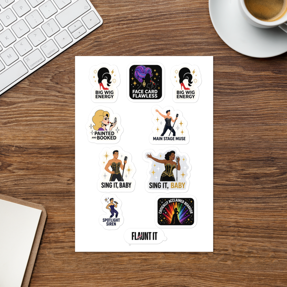 Flaunt It Drag Energy sticker sheet featuring eight colorful drag-themed glossy stickers on a wooden desk surface.