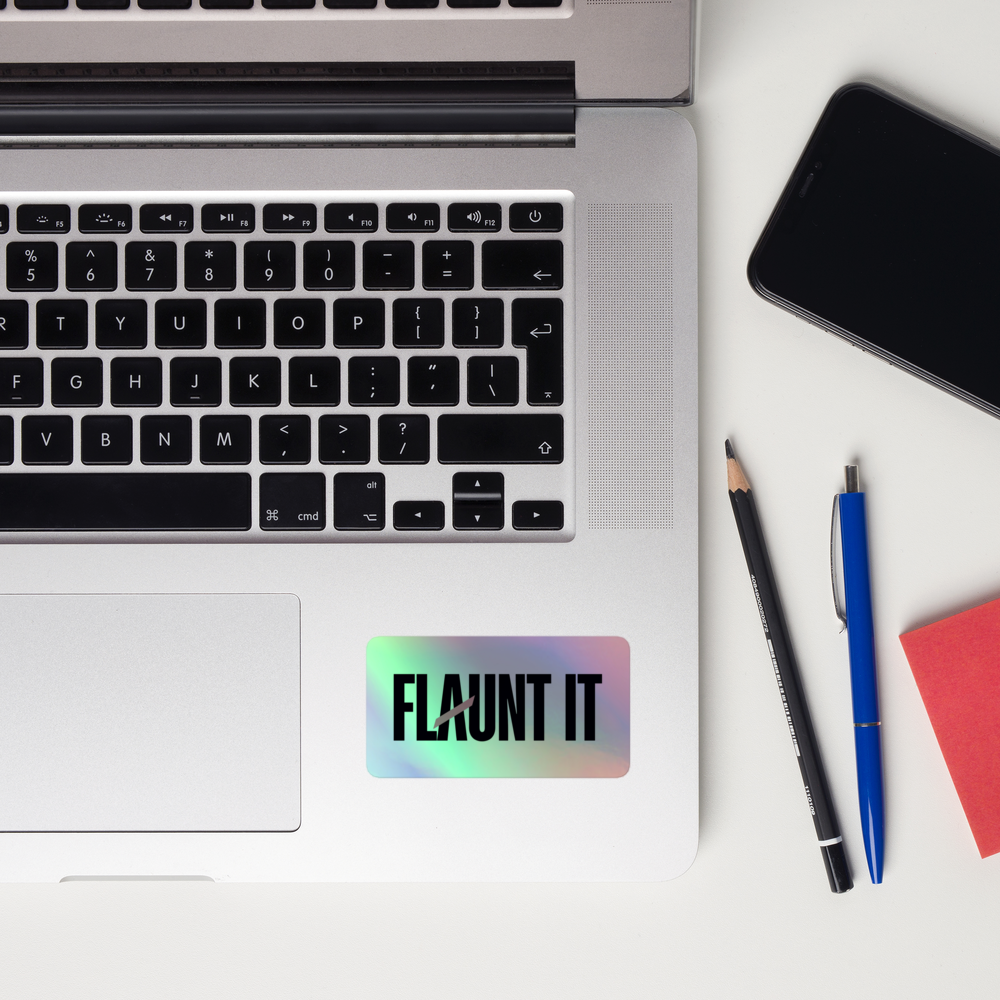 Flaunt It holographic vinyl logo sticker with 3D pattern applied to a silver laptop surface