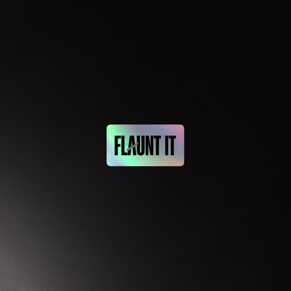 Flaunt It holographic vinyl sticker with a 3D embossed logo effect on a dark background