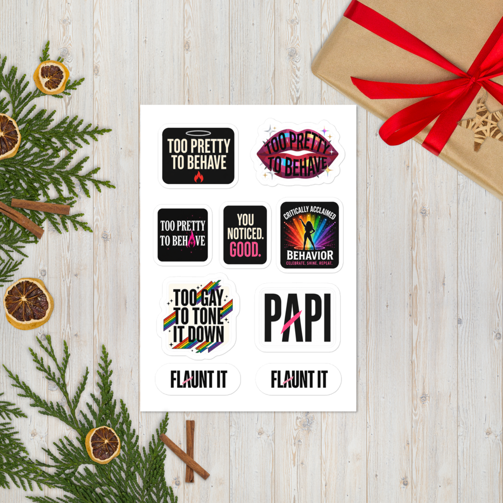 Flaunt It Main Character Energy sticker sheet featuring seven glossy, colorful statement designs on a wooden table.