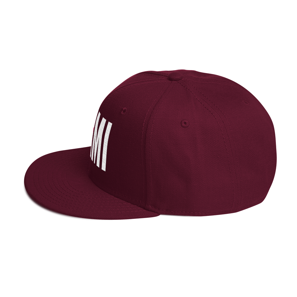 Flaunt It Mami structured snapback hat in burgundy with white embroidered text and a flat brim.