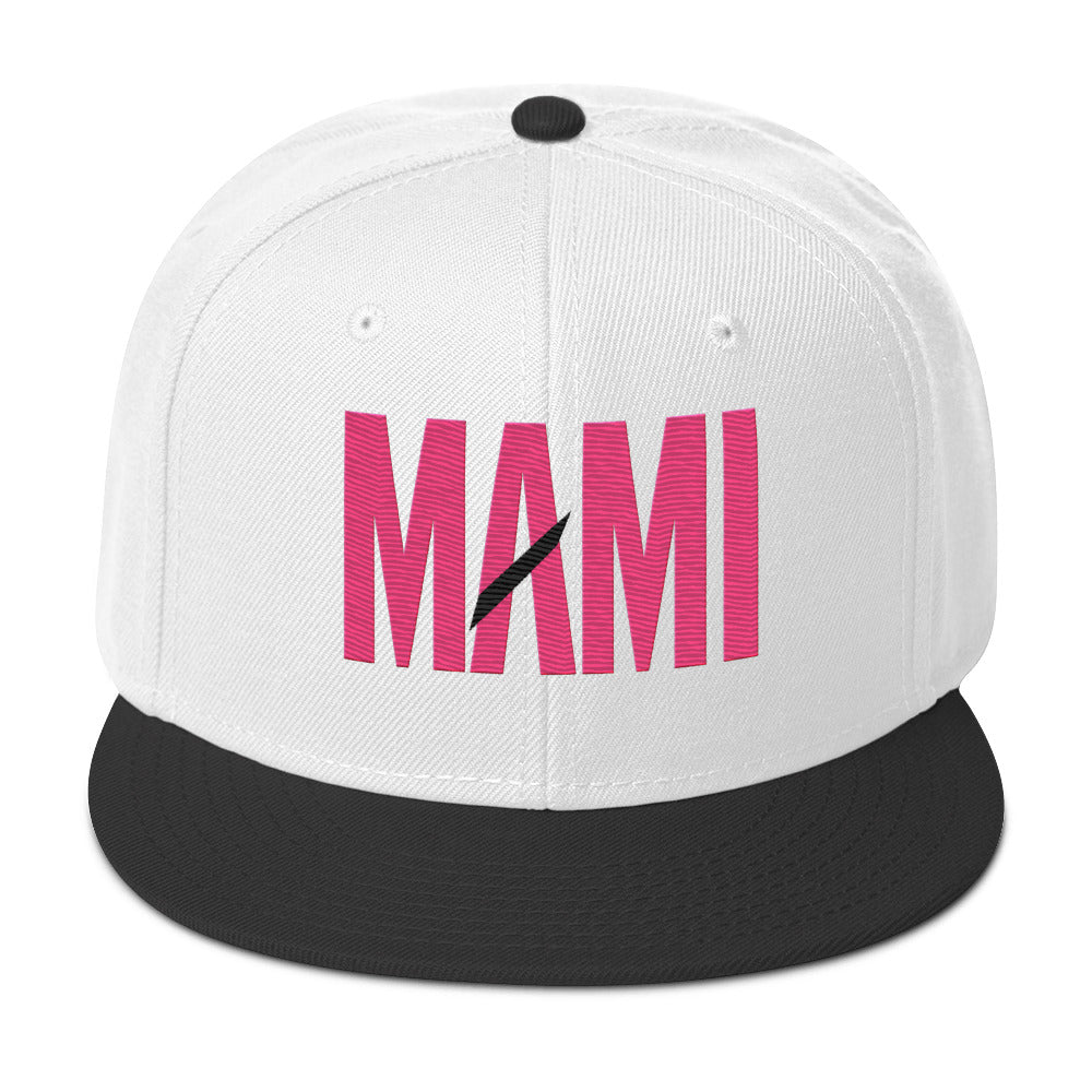 Flaunt It Mami embroidered snapback hat in white with a black brim and pink MAMI text featuring a diagonal slash.