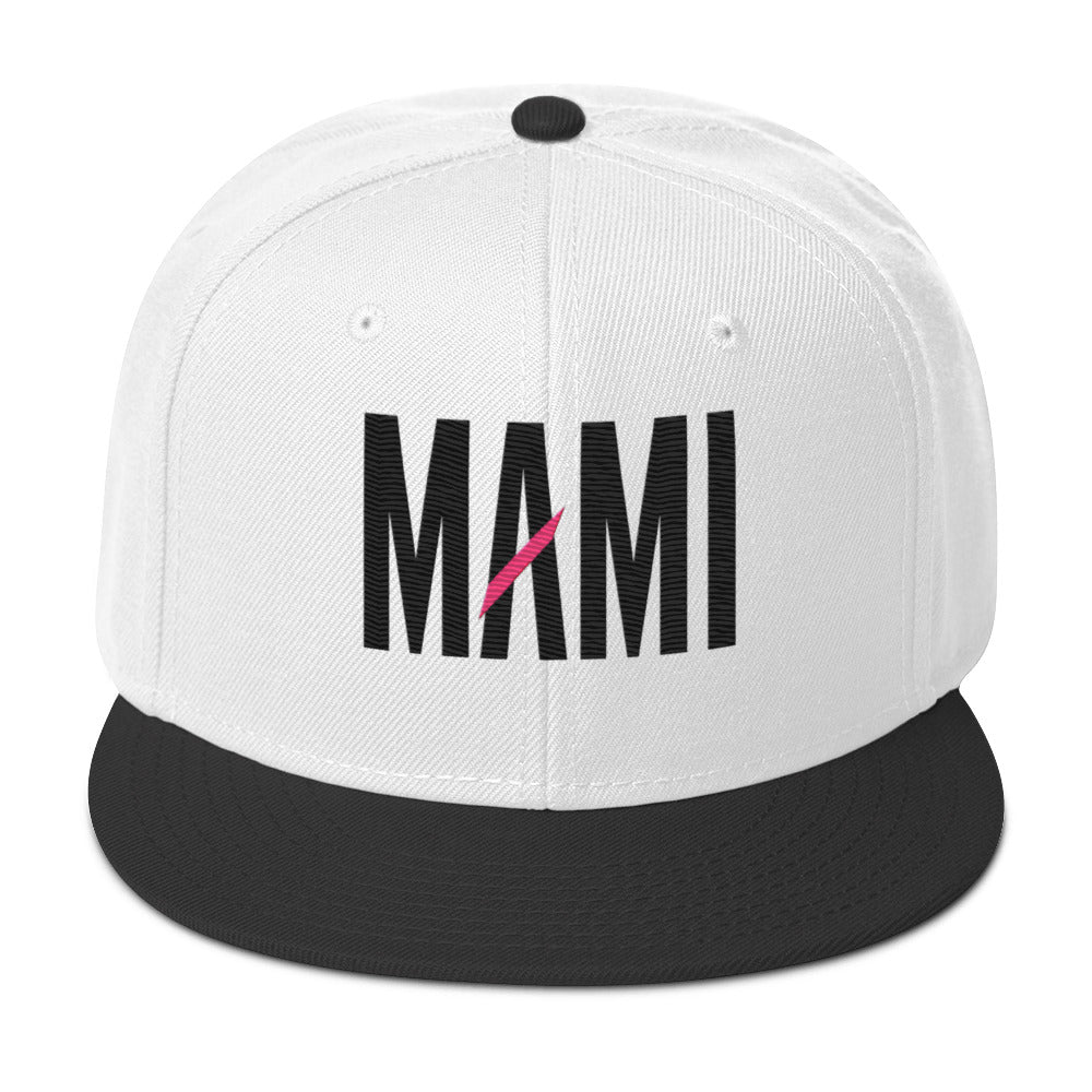 Flaunt It Mami embroidered snapback hat in white with a black flat brim and black MAMI text with a pink slash.