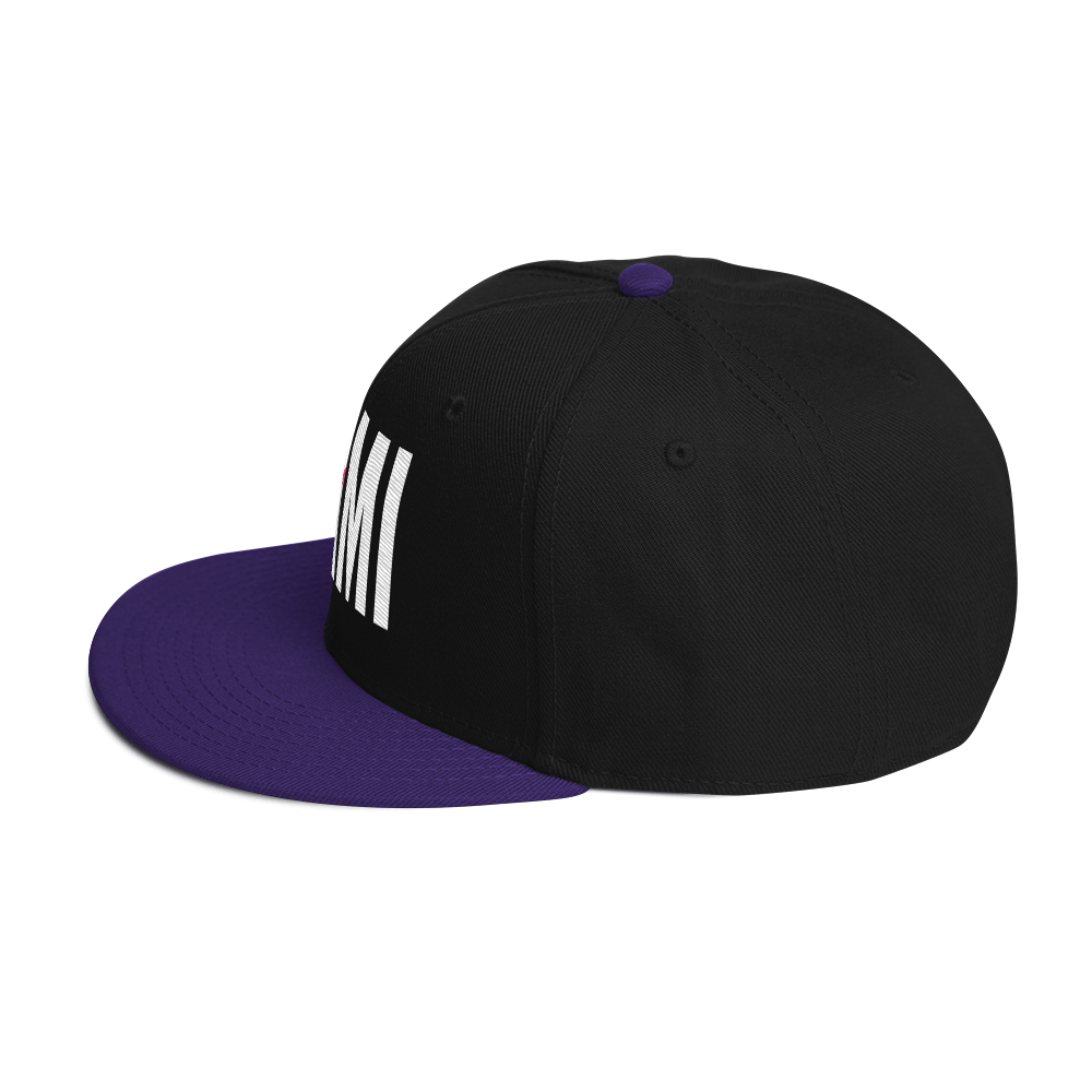 Flaunt It Mami embroidered snapback hat in black with a purple brim and top button, featuring white MAMI text.
