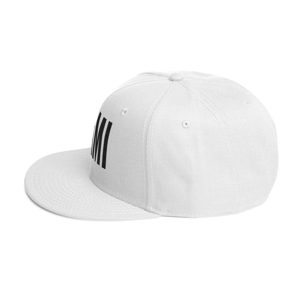 Flaunt It Mami embroidered white snapback hat with black text and a flat brim, side profile view.