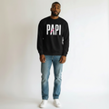 Flaunt It unisex heavyweight black long sleeve shirt with white PAPI text and a pink slash graphic on a male model.