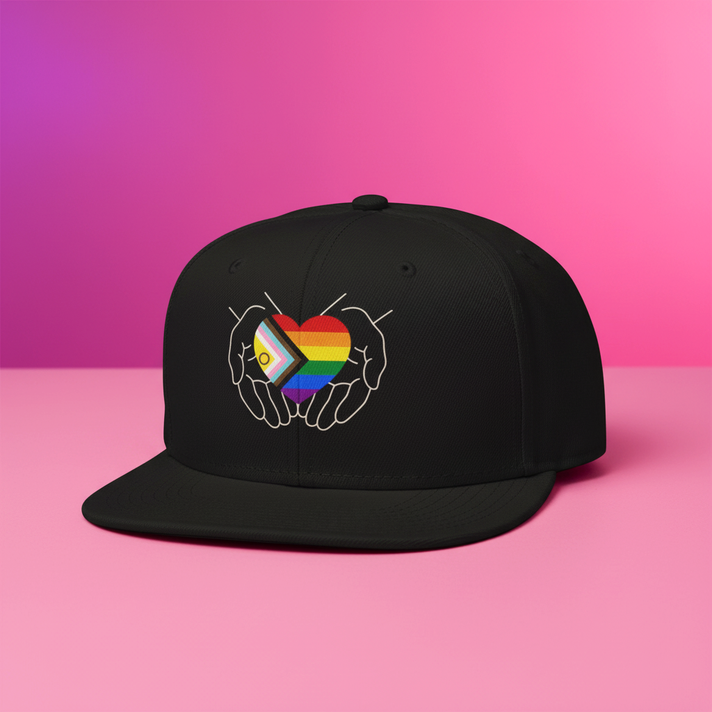 Flaunt It black structured snapback cap featuring a graphic of hands cradling an Intersex-Inclusive Progress Pride heart