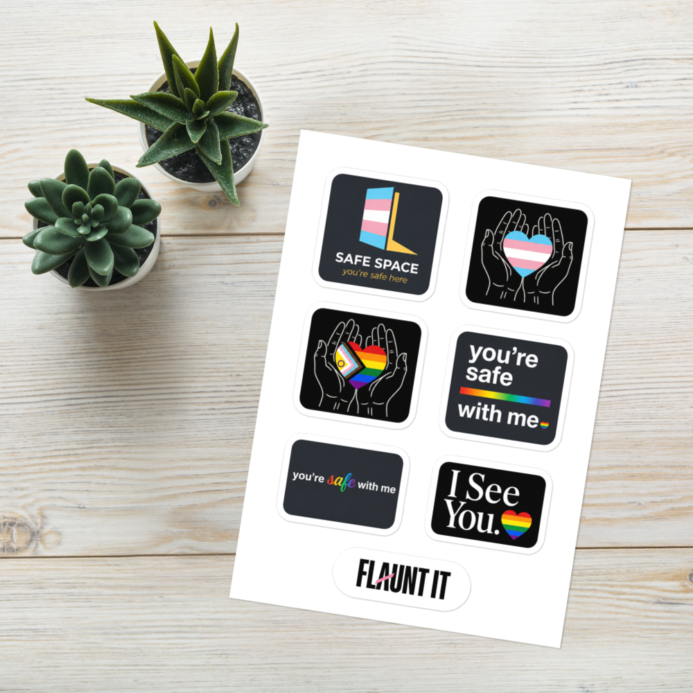 Flaunt It sticker sheet featuring six glossy LGBTQ+ pride and safe space designs on a light wooden background