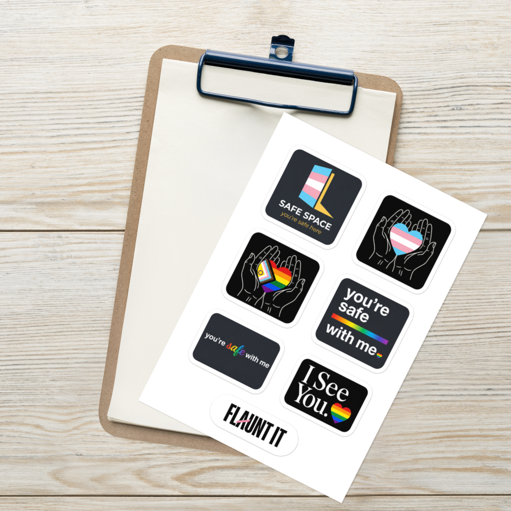 Flaunt It sticker sheet featuring six glossy LGBTQ+ allyship designs on a clipboard over a wooden surface.