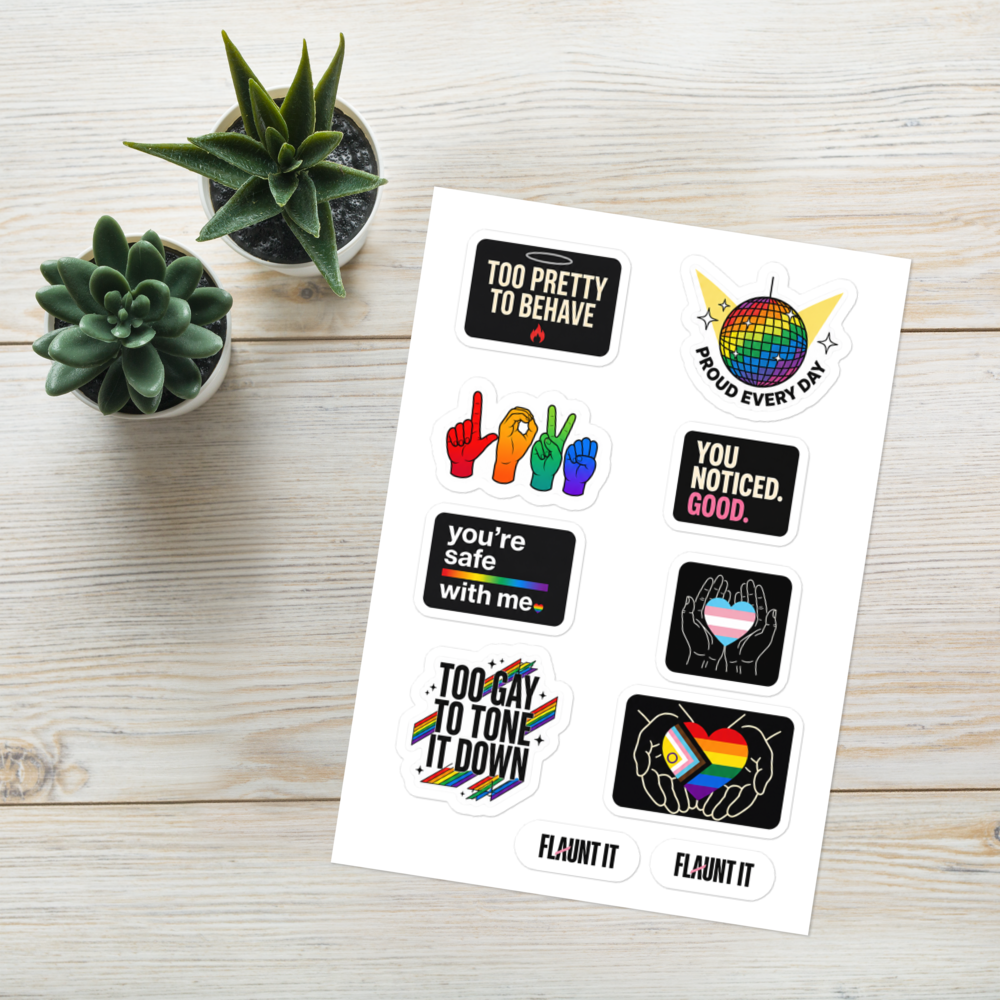 Flaunt It Proud All Year sticker sheet featuring eight glossy LGBTQ+ themed designs on a white wooden background.
