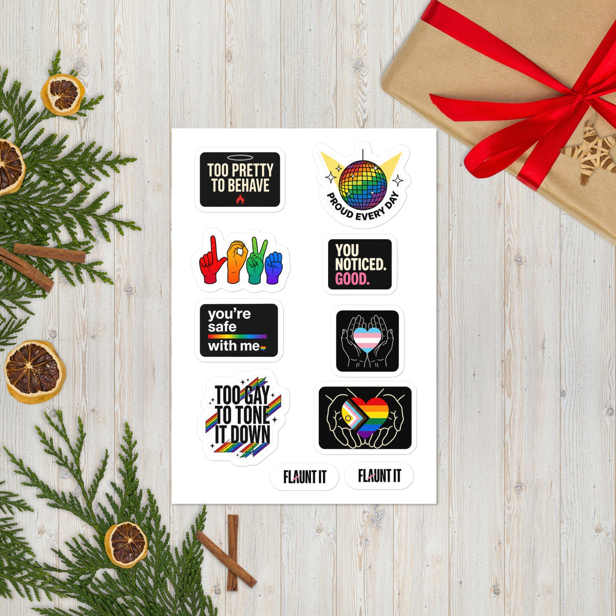 Flaunt It Proud All Year sticker sheet featuring eight glossy pride-themed designs on a white background with decor.