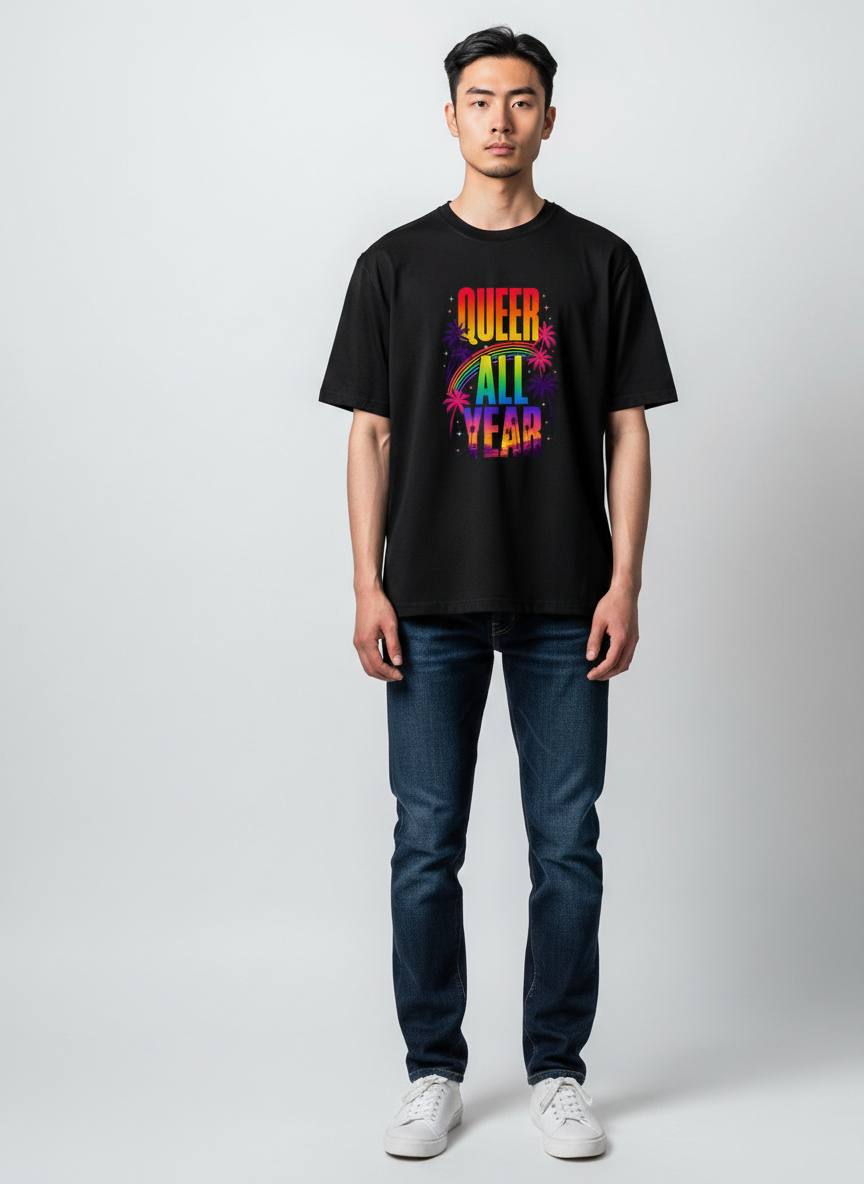 A man wearing a black Flaunt It premium cotton t-shirt with a colorful Queer All Year West Hollywood graphic print.