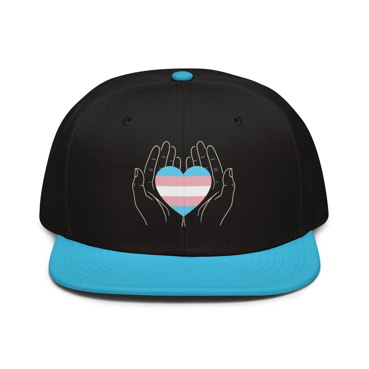 Flaunt It snapback cap featuring hands holding a trans pride heart graphic on a black crown with a blue flat visor.