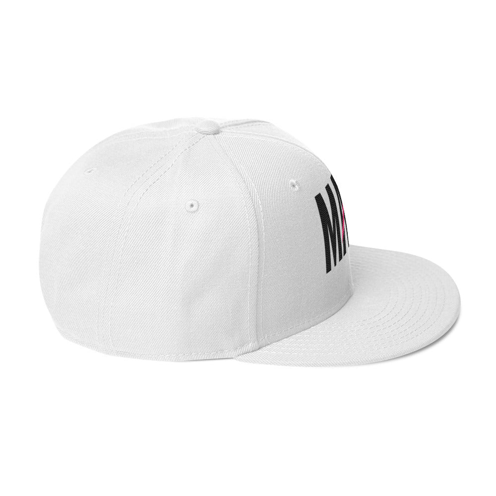 Flaunt It white structured snapback hat with MAMI embroidered in black thread and a pink diagonal slash on the brim.