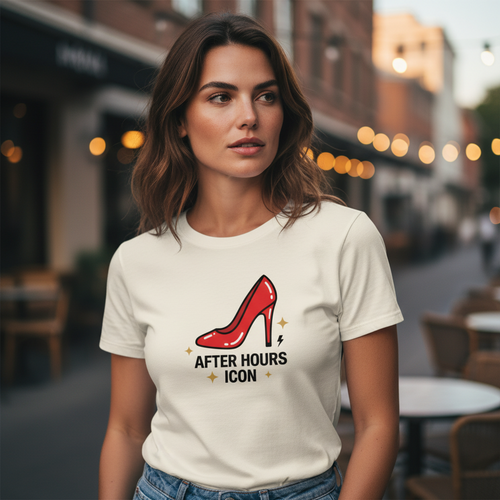 Woman wearing a white Flaunt It premium cotton crew neck tee featuring a red high heel graphic and After Hours Icon text.