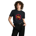 Una Canción Más Premium Unisex T-Shirt in Navy, front view on a model, with the UNA CANCIÓN MÁS watercolor two women dancing design